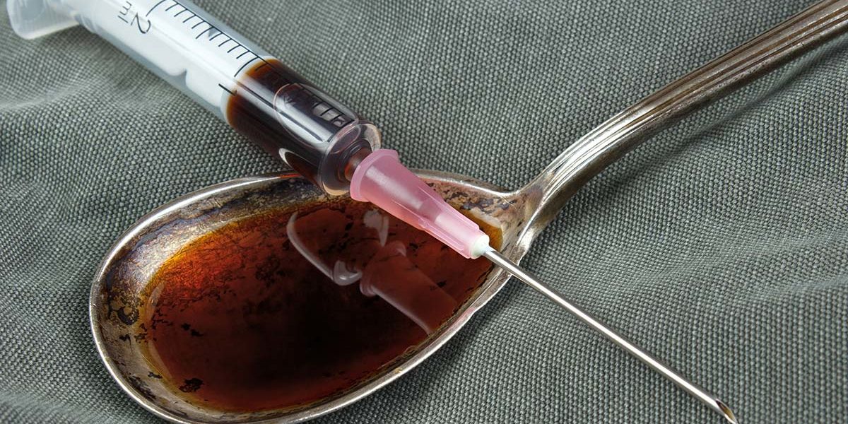 heroin in a syringe and spoon during the heroin epidemic in America