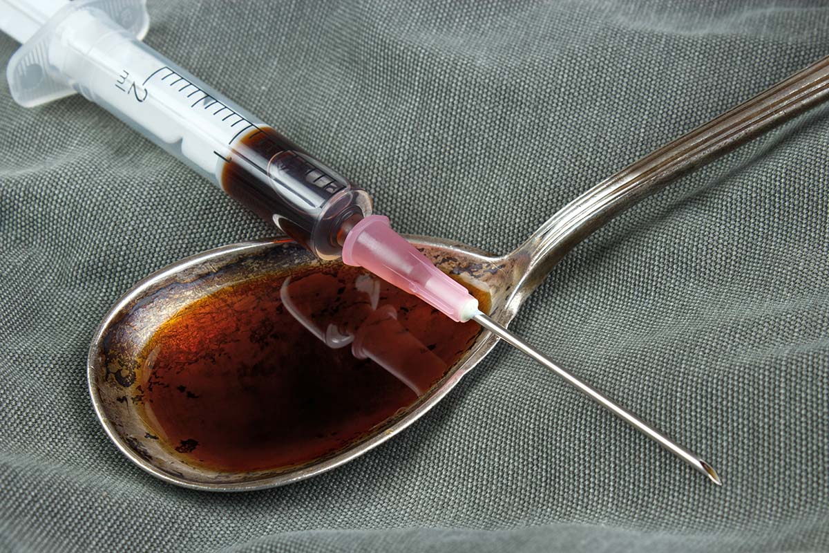 heroin in a syringe and spoon during the heroin epidemic in America