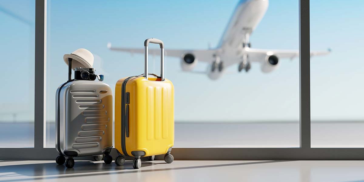 luggage at the airport as a plane takes off for someone traveling for treatment