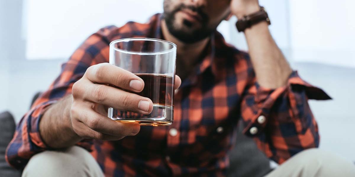 man deals with the disease of alcoholism