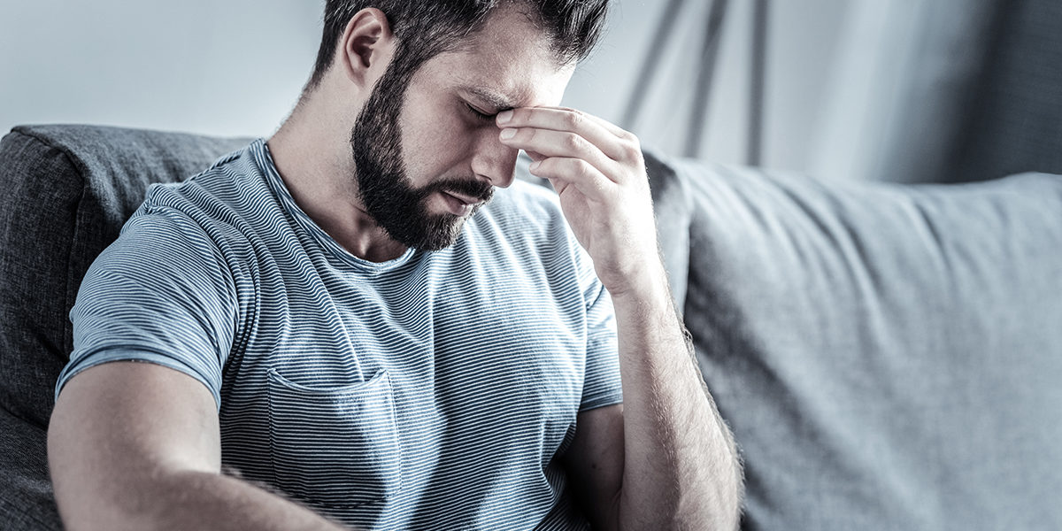 man pinching his nose wondering What Is Drug Abuse