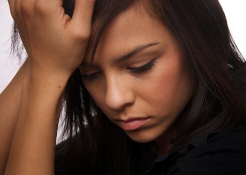 Distressed young woman wishing she did not have a substance abuse disorder.