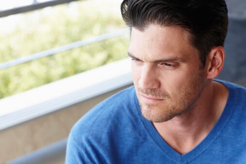 Man in blue shirt concentrating about how long does it take to detox from alcohol?