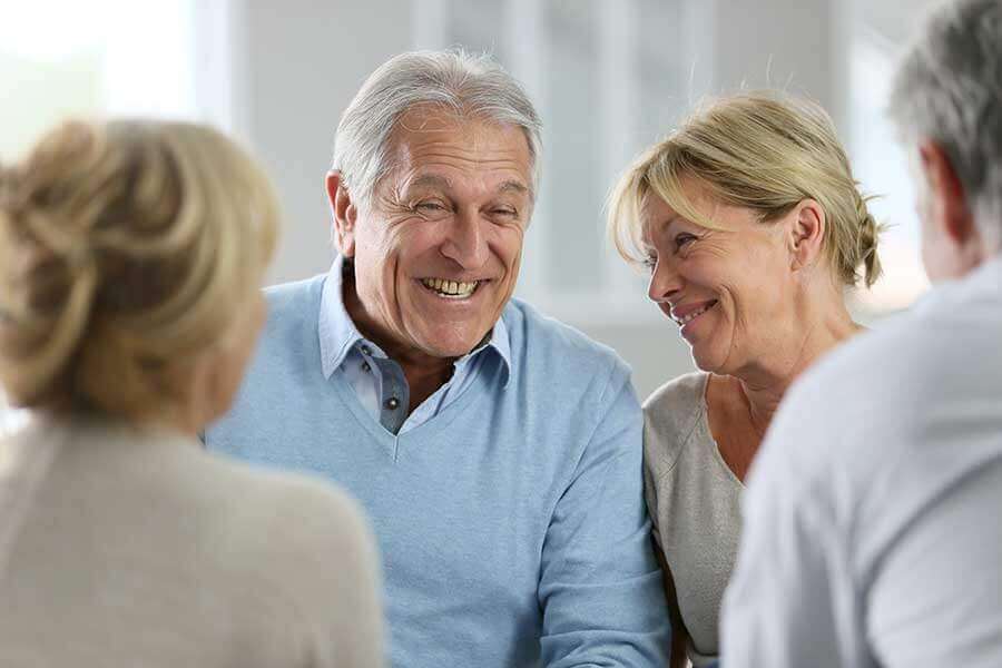 Elderly couple smiling and laughing