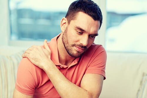 Man rubbing shoulder knows he needs a relapse prevention plan after rehab