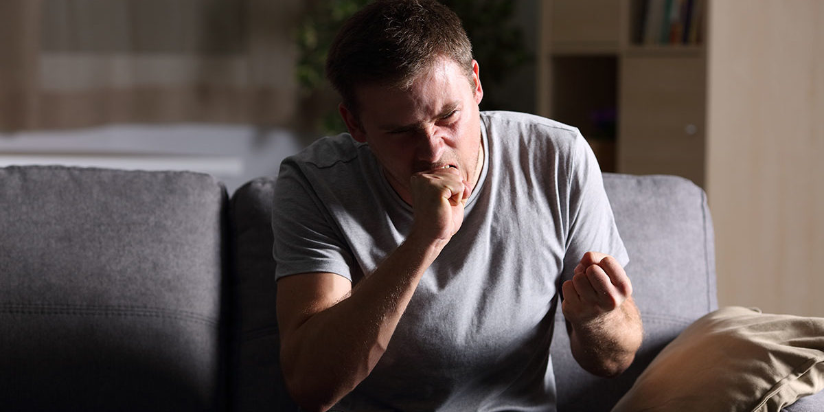 furious man on couch needed anger management techniques