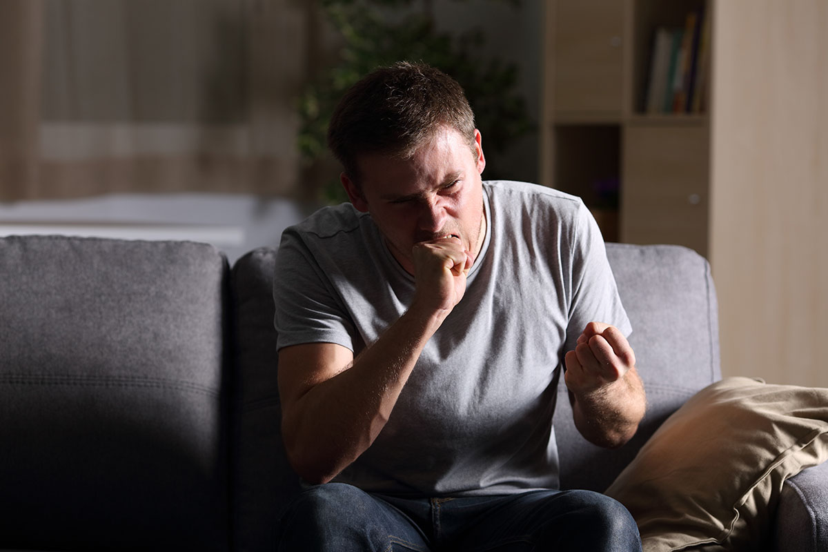 furious man on couch needed anger management techniques