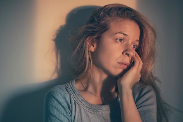 woman distraught about cycle of addiction