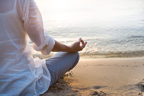 Holistic healing at Beaches Recovery may include meditation therapy on the beach.