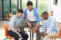 Men engaging in substance abuse group therapy activities