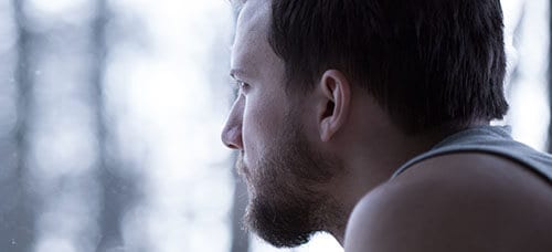 Sad bearded man wondering why addiction relapse always happens.