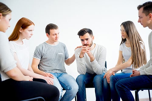 Group therapy topics often include compassionate listening, like this group.