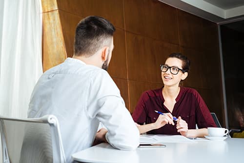 Counselor and client in therapy, using drug addiction counseling techniques that work.