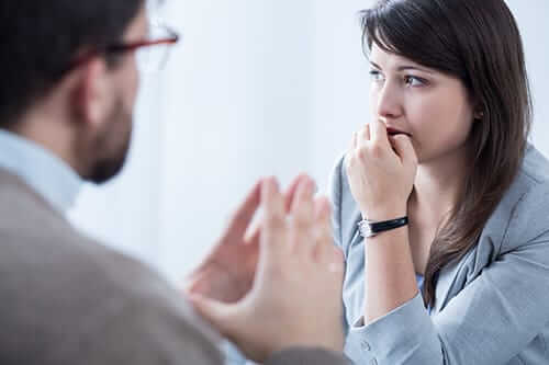 Worried woman talking to a man who thinks she needs cocaine detox