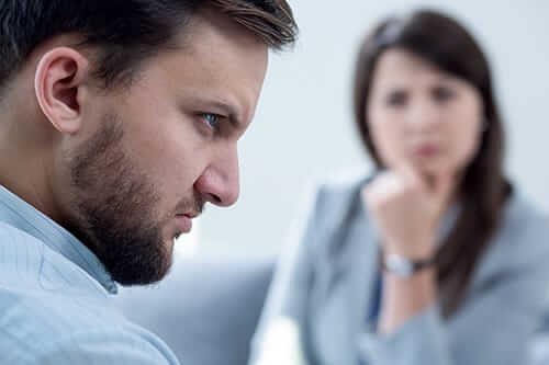 Angry man talking to counselor surely needs a cocaine withdrawal treatment program