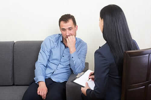 Counselor talking to client about the alcohol detox process