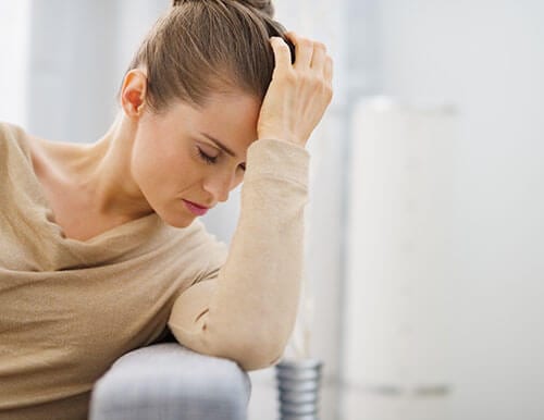 Depressed woman thinking she needs a womens prescription drug rehab center for her addiction