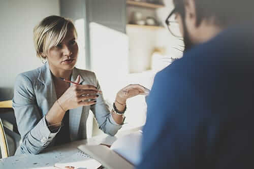 Intake counselor talking to client about ADHD and addiction