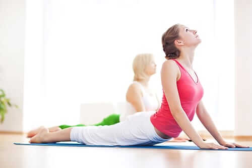 Participating in yoga therapy during drug rehab