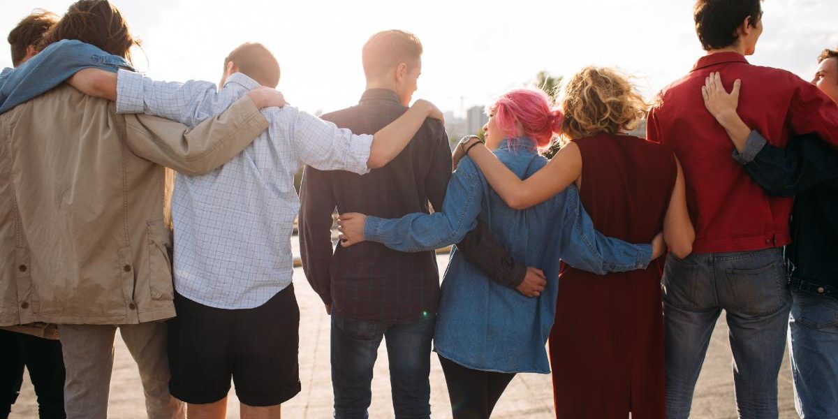 a group of people in a line with arms around each other discussing private drug rehab centers in Northern Florida