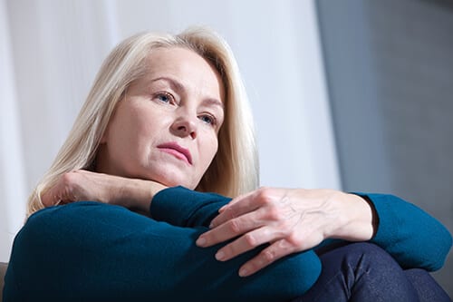 Older woman looking sad may need acute stress disorder treatment