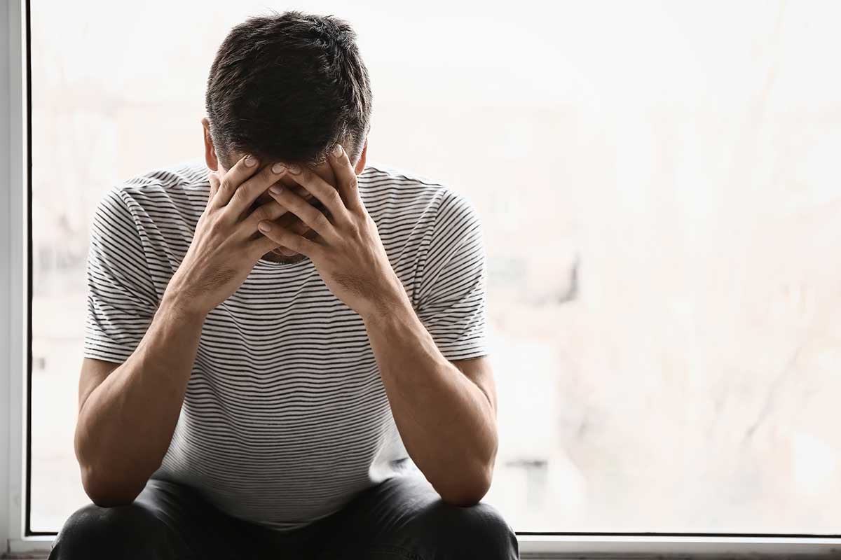 man considers his anger and addiction recovery