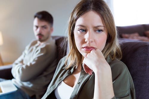 Distraught couple dealing with divorce and addiction