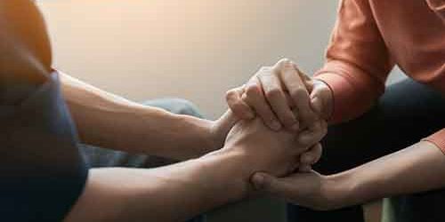 hands holding hands for mental wellness month