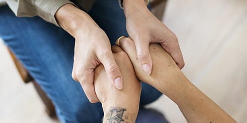 Clasping hands at Gainesville drug rehab centers