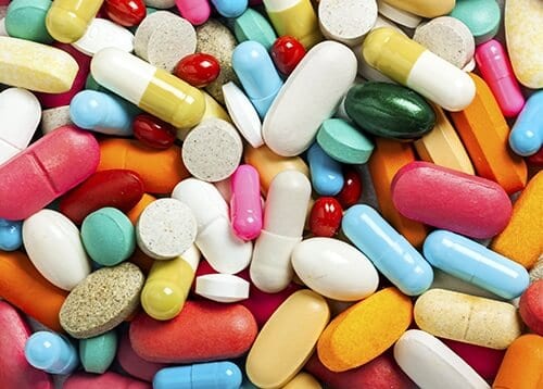 Pile of pills which make up over the counter drug abuse statistics