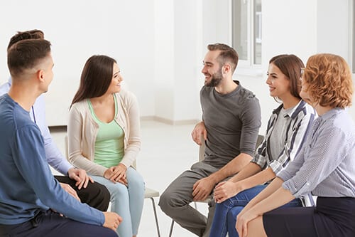 people participate in group therapy at a north florida rehab center