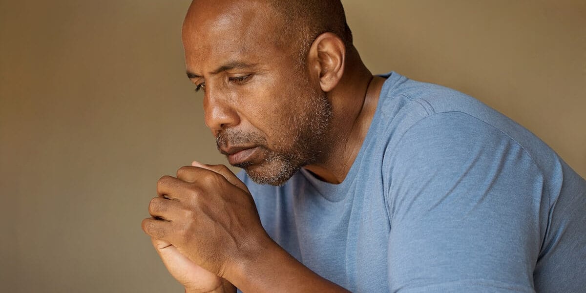 bald man wondering how to cope with grief in recovery