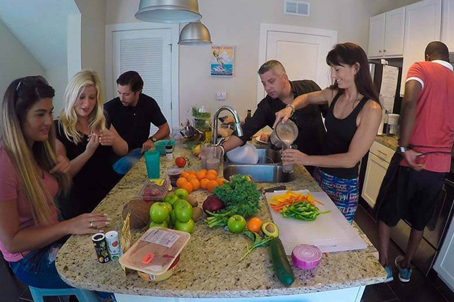 Patients in a Beaches Recovery Drug Rehab House talking in the kitchen