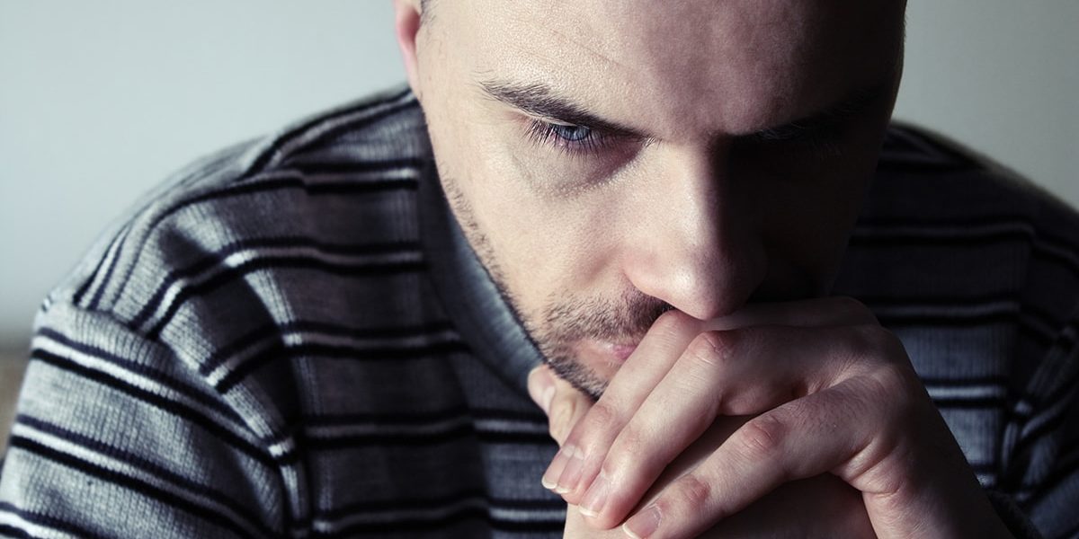 Man wondering how to stop alcohol withdrawal shakes
