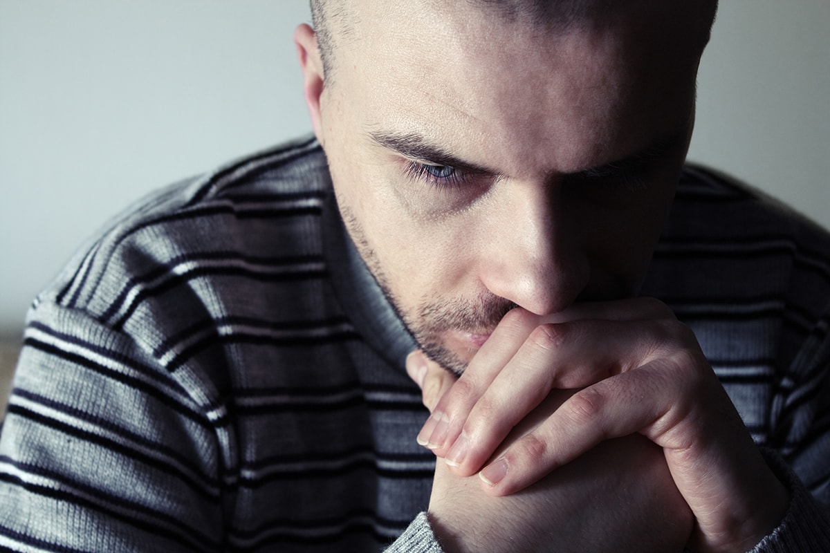 Man wondering how to stop alcohol withdrawal shakes