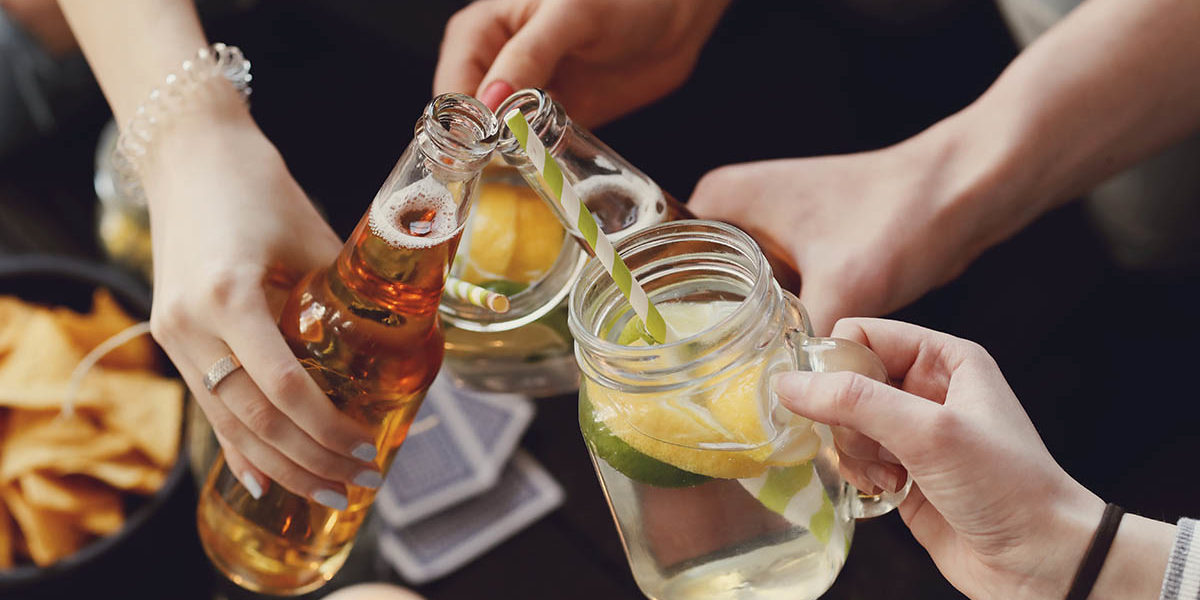 people raising drinks together need to know the difference between a social drinker and alcoholic