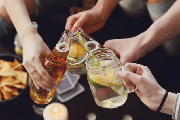 people raising drinks together need to know the difference between a social drinker and alcoholic