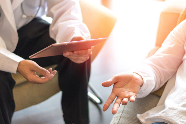 therapist goes over the benefits of reality therapy with a patient