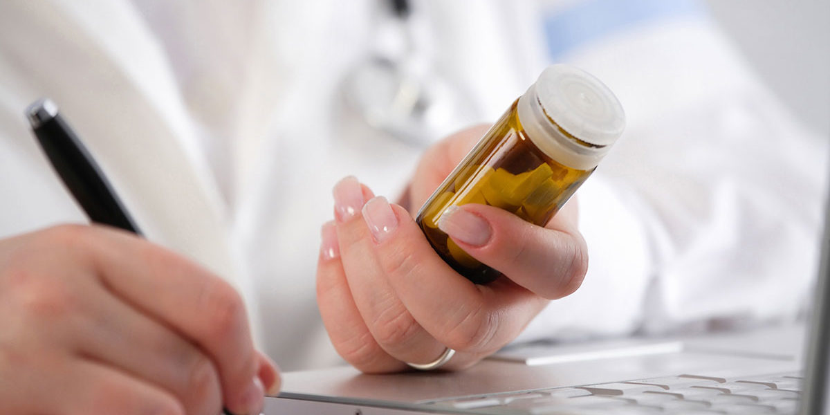 Doctor prescribing medications used in detox