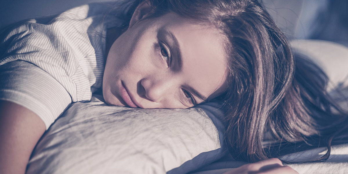 a woman in bed wondering can you die from cocaine withdrawal