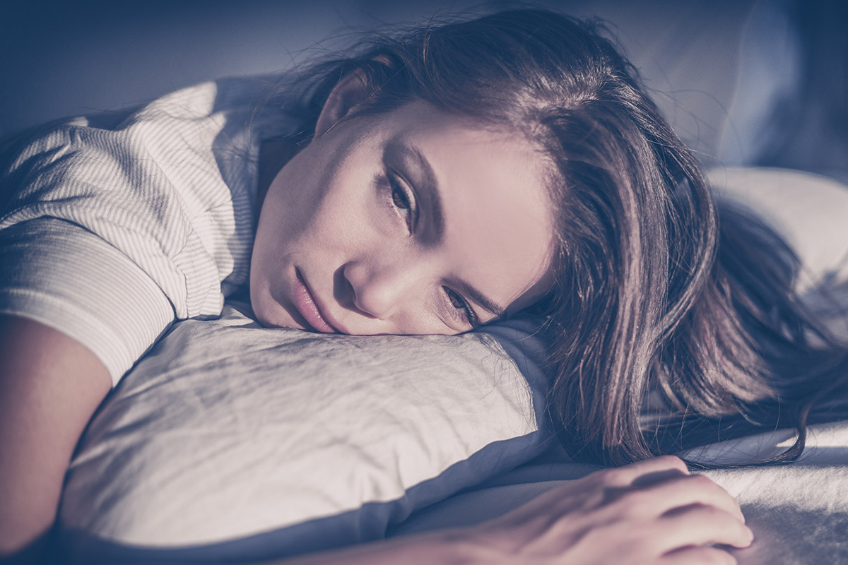 a woman in bed wondering can you die from cocaine withdrawal