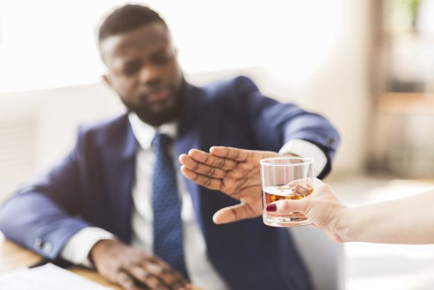 man refusing alcoholic drink after successful alcohol addiction detox treatment in florida