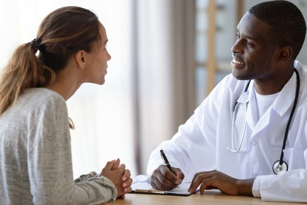 doctor discussing the benefits of inpatient drug detox with woman