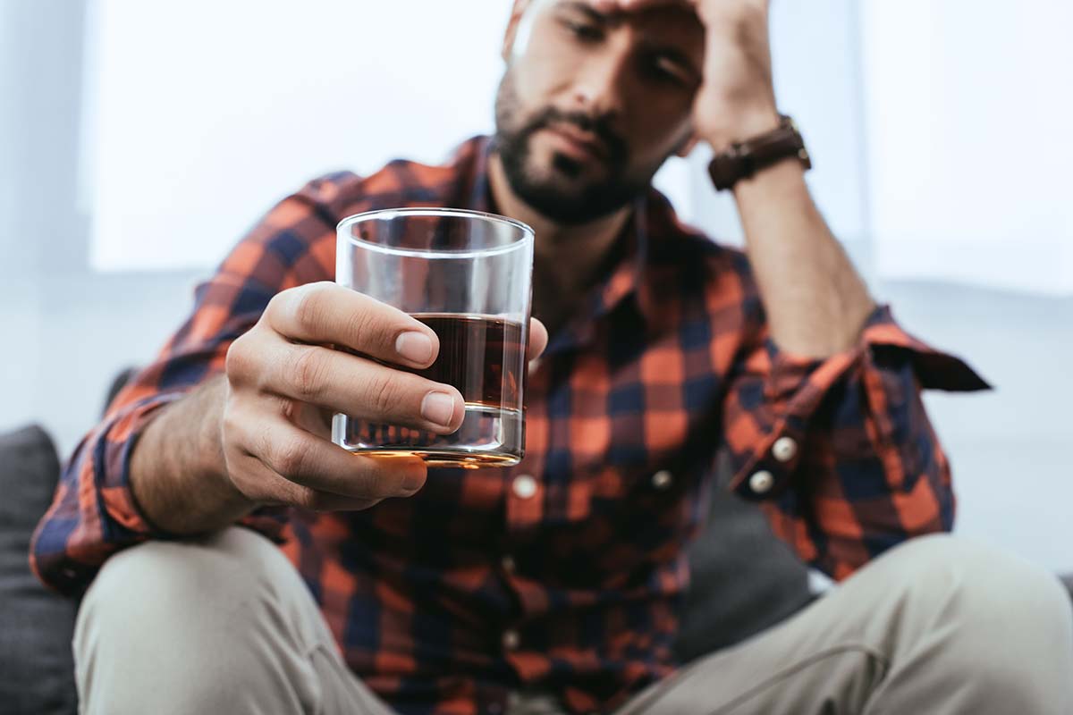 man taking a drink thinking he needs to seek alcohol treatment centers in florida