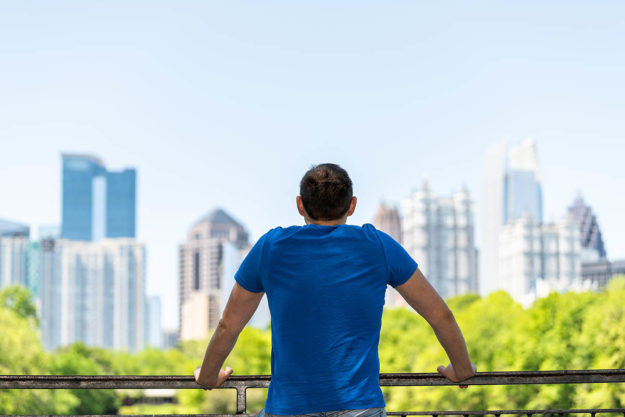 man looking out at the city from the men's drug addiction rehab atlanta ga