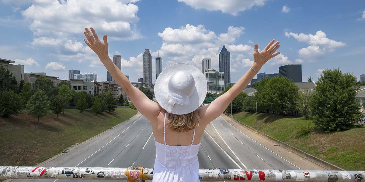 woman with arms outstretched after visiting women's alcohol addiction rehab atlanta ga