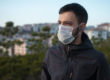 man outside wearing mask knowing difference between epidemic vs pandemic