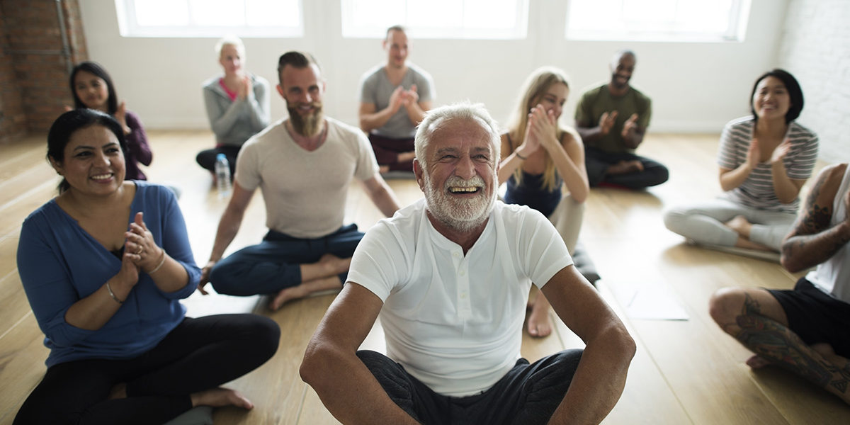 senior man laughing during Addiction Group Therapy Activities