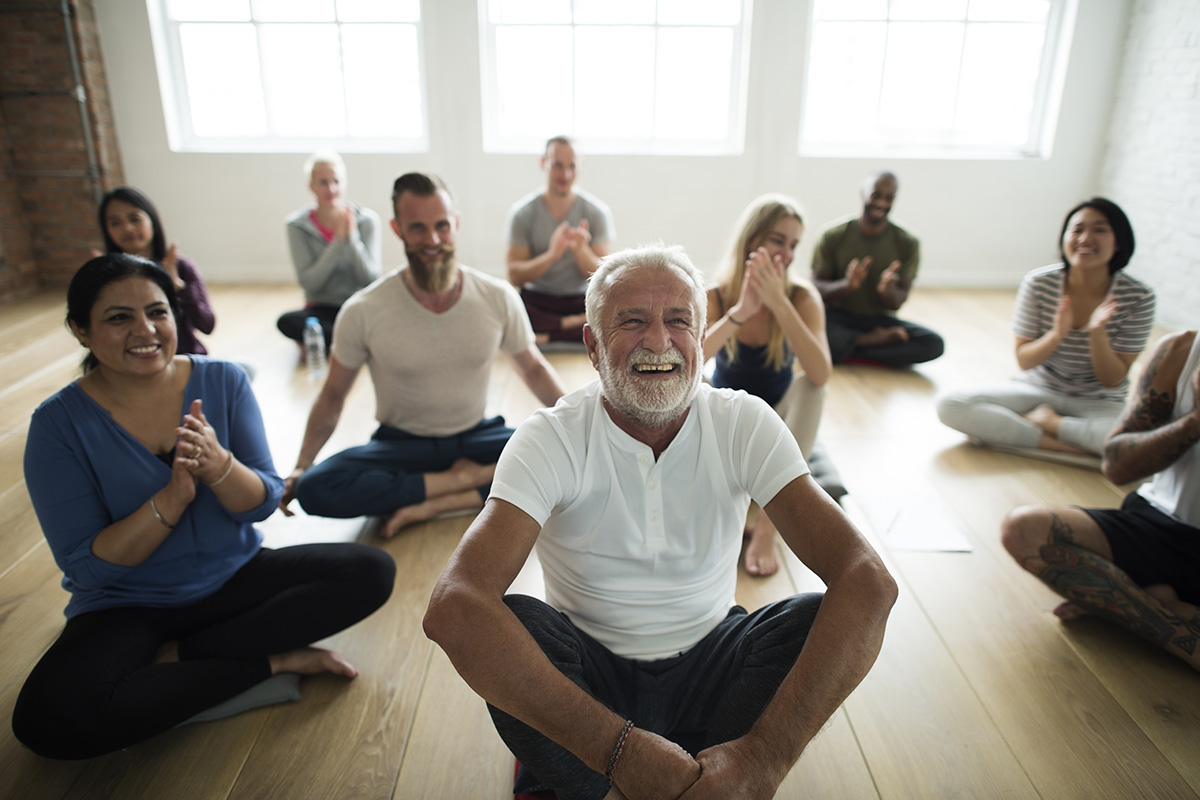 senior man laughing during Addiction Group Therapy Activities