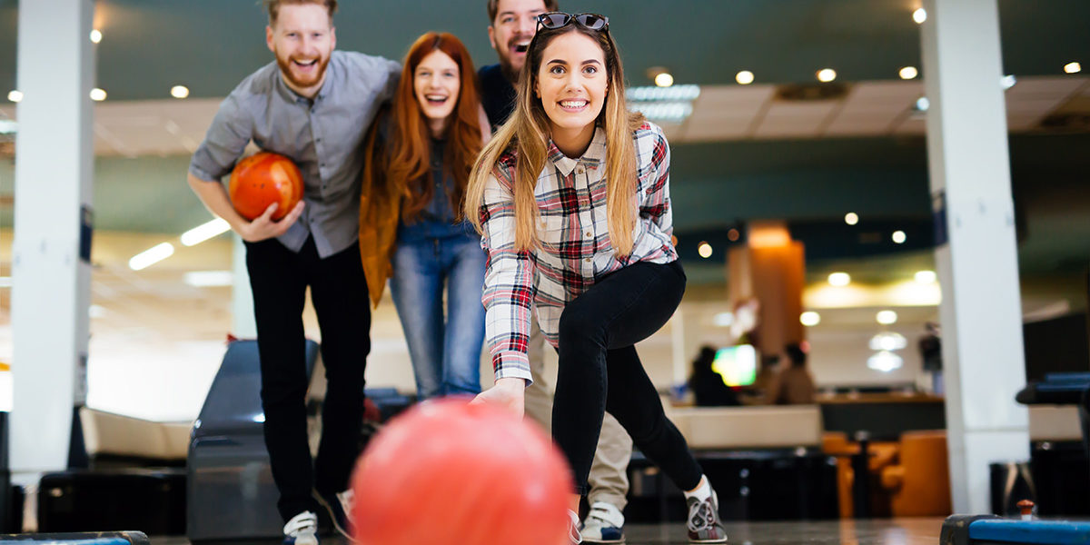 group of young people Bowling in Drug Rehab